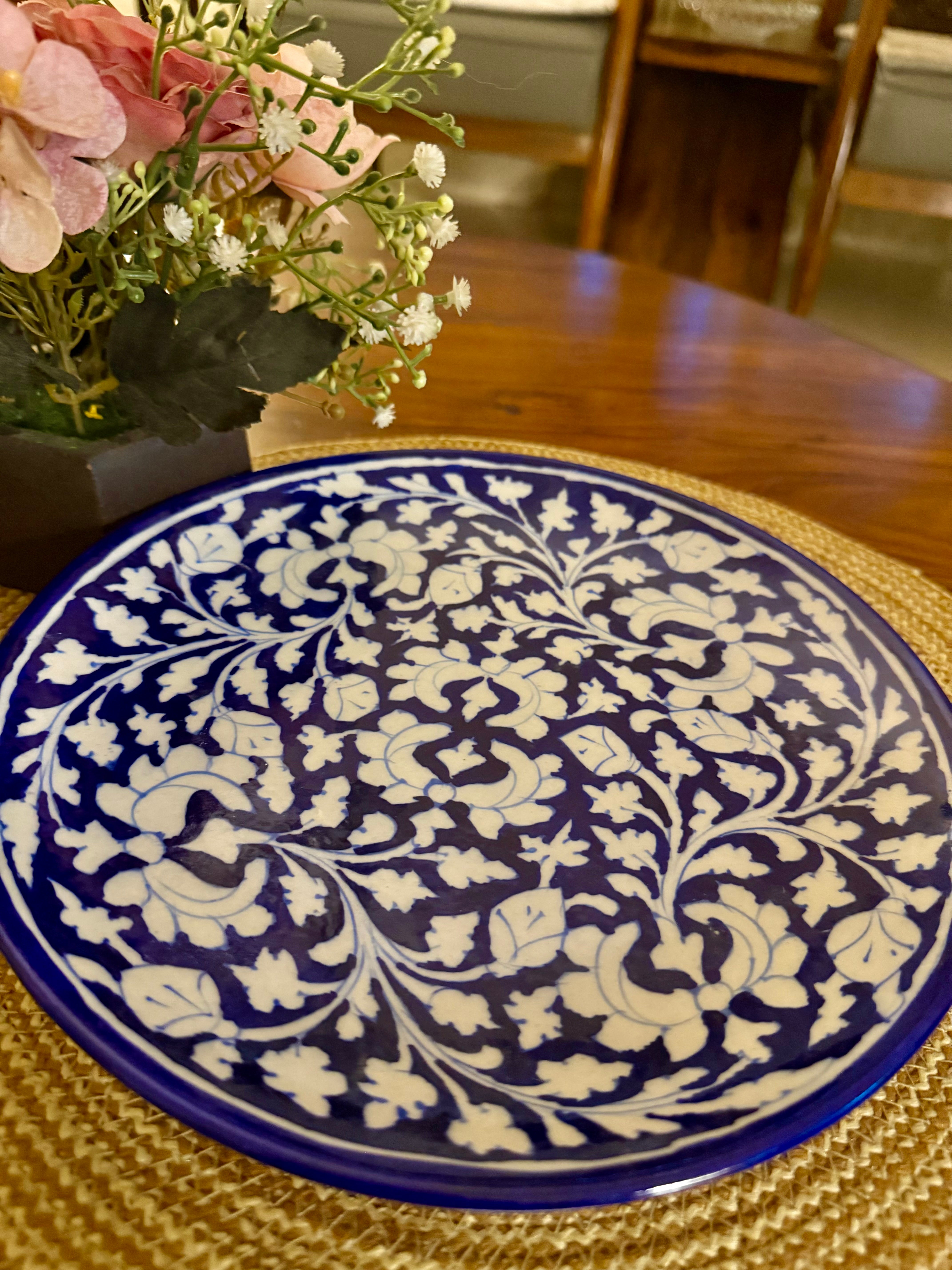 Traditionally hand-crafted blue pottery wall plate
