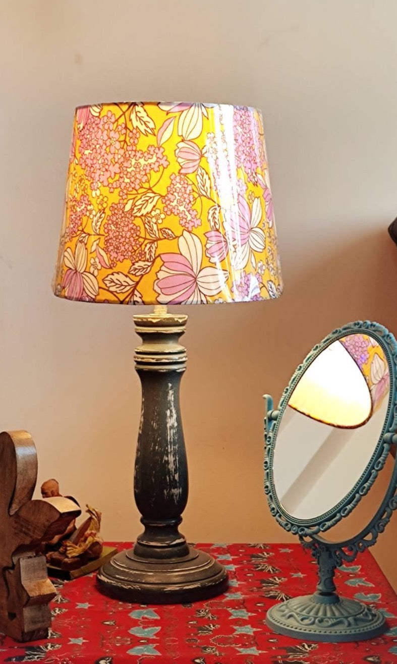 The antique and rustic wooden table lamp